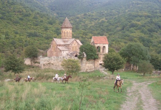 Riding past the monestry