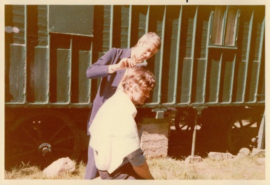 Ronnie Cogan cutting Martin Neville's hair