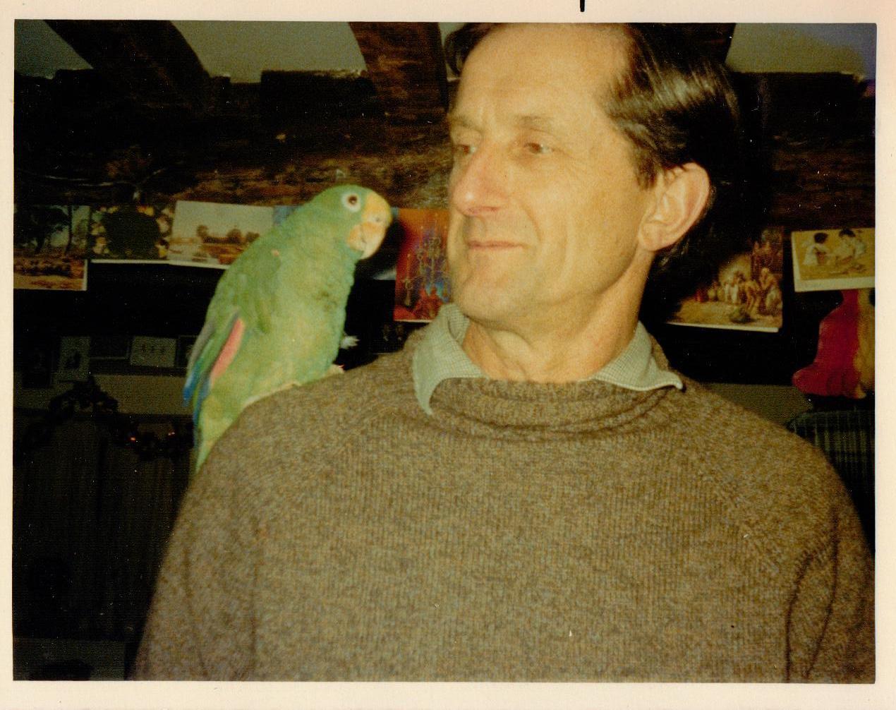 Roger Lee with our parrot Chico Roger Lee with our green parrot Chico