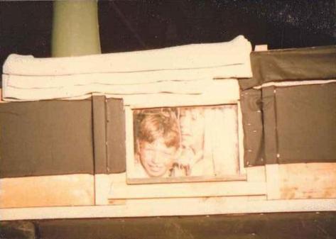 Nicholas Walpole and Jake Coppard looking out of the window of the set that was made to represent the interior of the Death and Glory 