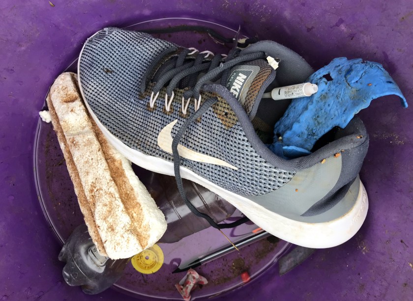 Rubbish - a shoe washed up on the beach